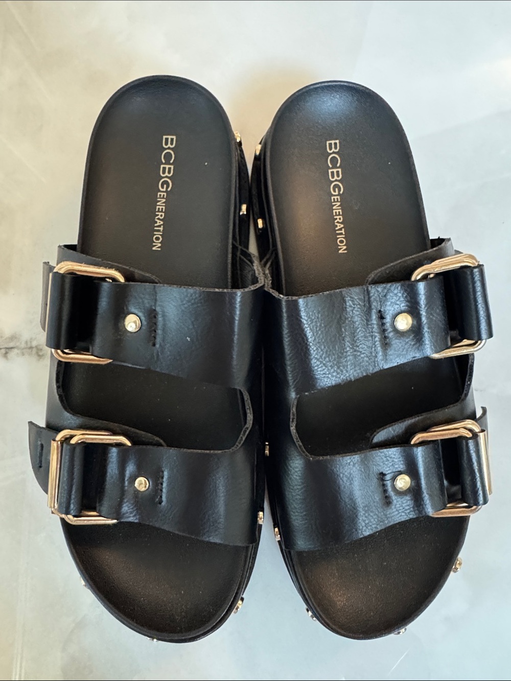 BCBGeneration Black Slide Sandals with Gold Buckles